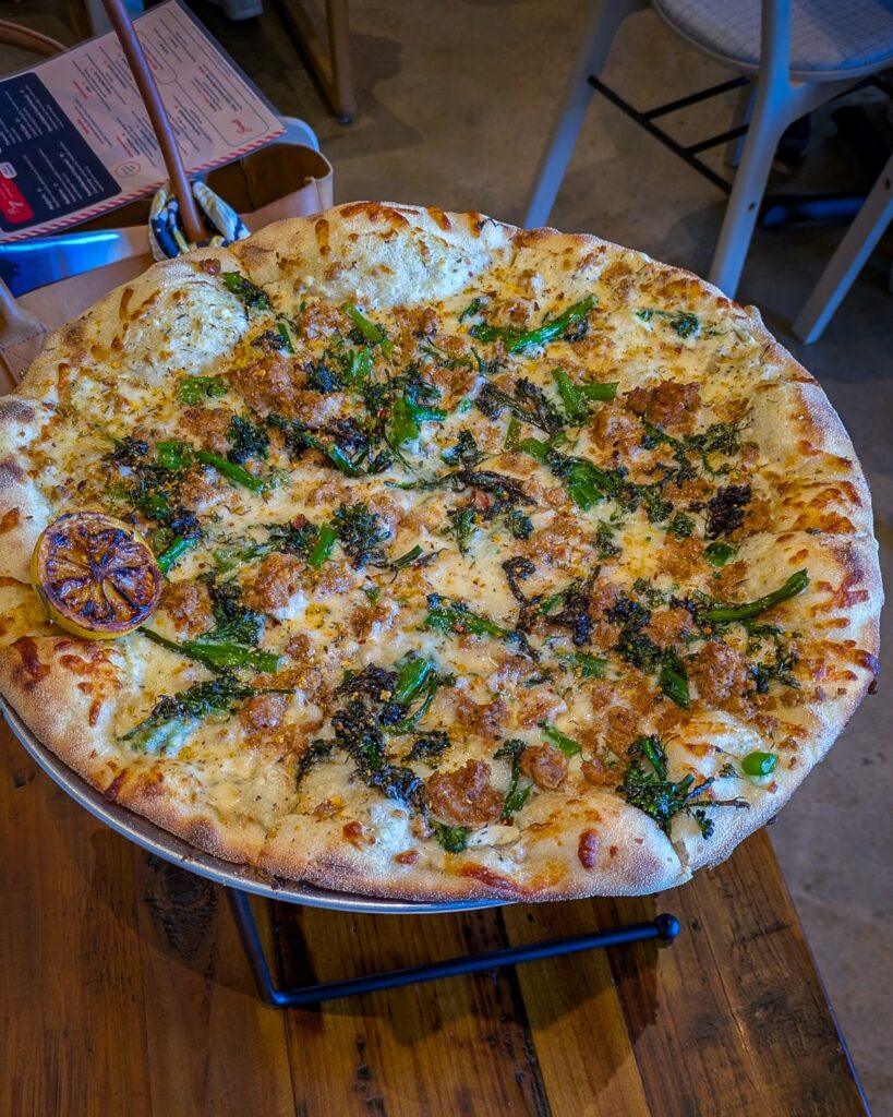Broccoli rabe and fennel sausage pizza