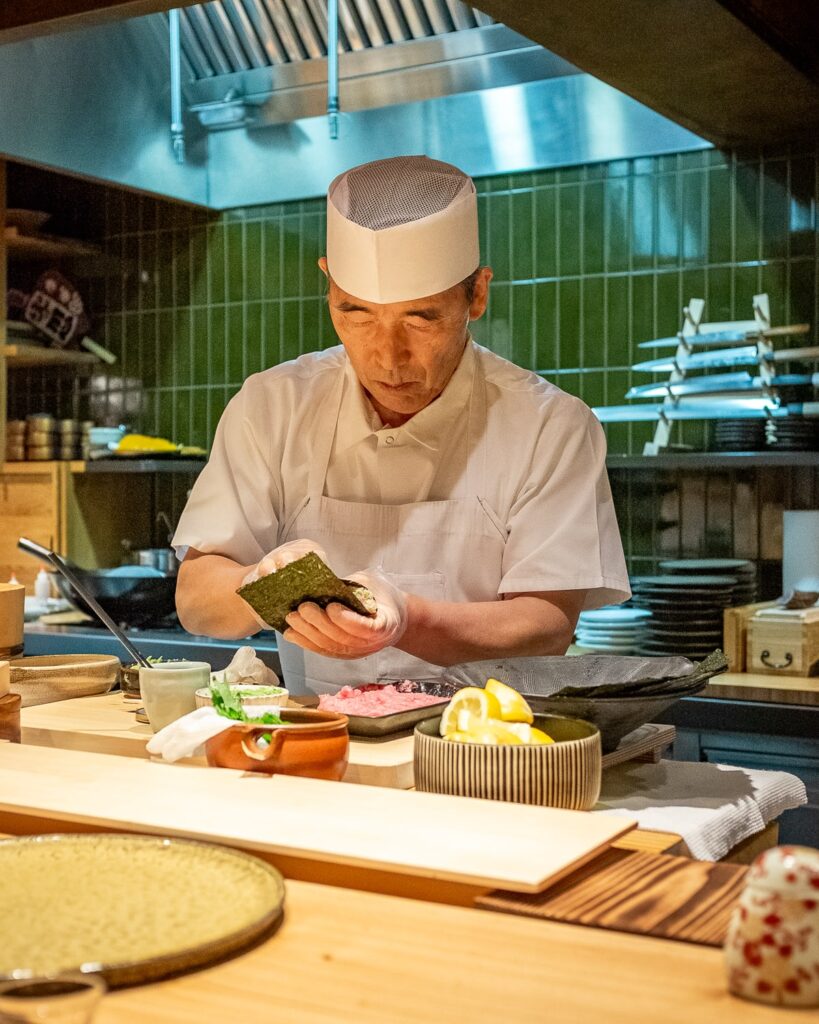 Toshi Kizaki prepares a handroll at his chef's counter